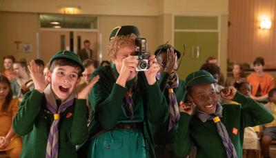 Picture shows: Nurse Phyllis Crane (Linda Bassett) takes a photograph surrounded by enthusiastic Cub Scouts