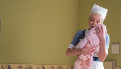 Picture shows: Nurse Trixie Franklin (Helen George) holds a sick newborn baby.