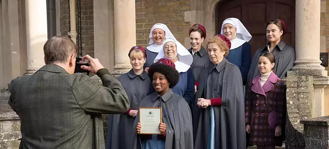 Clockwise from left: Natalie Quarry as Rosalind Clifford, Rebecca Gethings as Sister Veronica, Jenny Agutter as Sister Julienne, Laura Main as Shelagh Turner, Judy Parfitt as Sister Monica Joan, Linda Bassett as Nurse Phyllis Crane, and Renee Bailey as Joyce Highland get their photo taken in front of Nonnatus House in 'Call The Midwife' Season 13