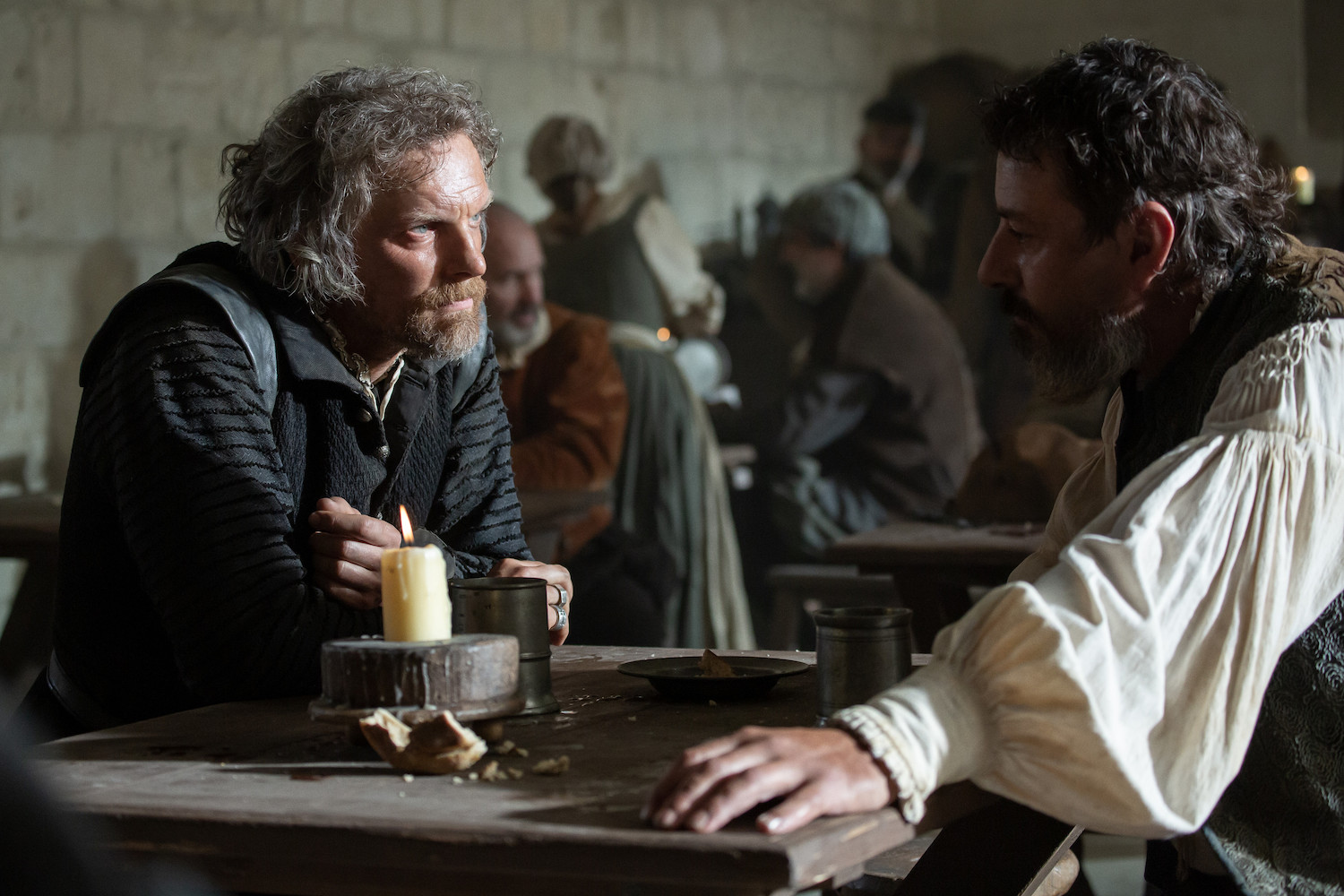 Picture shows: Montmorency (Barry Atsma) and Ruggiero (Enzo Cilenti) sit at a table in a tavern.