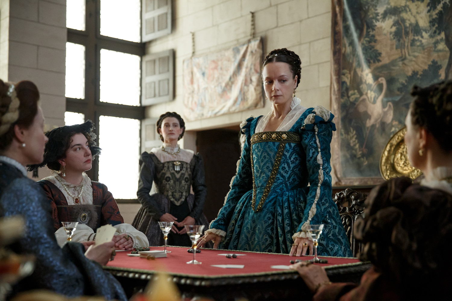 Picture Shows: Catherine (Samantha Morton) leaves the card game when she is insulted by Queen Eleanor (Rebecca Gethings).
