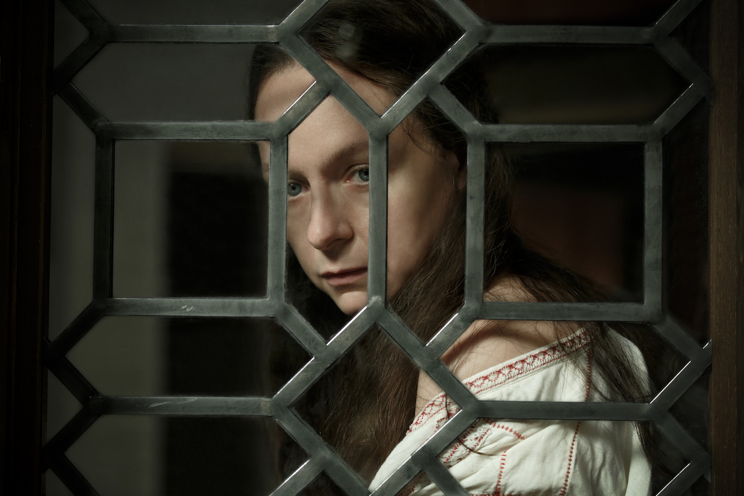 Picture Shows: Catherine de Medici (Samantha Morton) looking out of a window, grieving