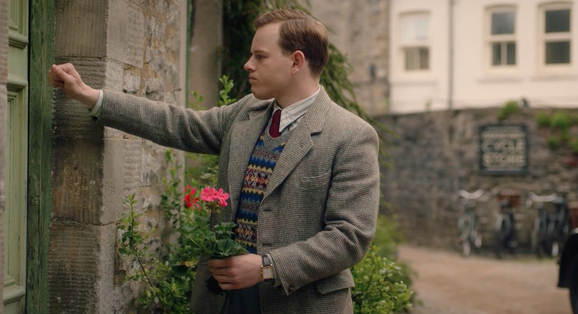 Picture shows: Tristan Farnon (Callum Woodhouse) bangs on the door of the boarding house where Florence lives. He holds a geranium that has a clump of dirt at its base.