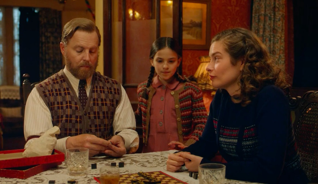 Picture shows: Seated at a table, Siegfried (Samuel West) plays scrabble with Helen (Rachel Shenton) while Eva (Ella Bernstein) stands between them.