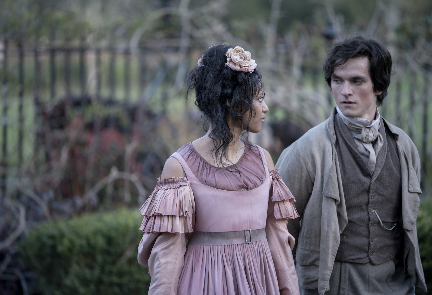 Picture shows: Pip (Fionn Whitehead) and Estella (Shalom Brune-Franklin) walk together in the garden