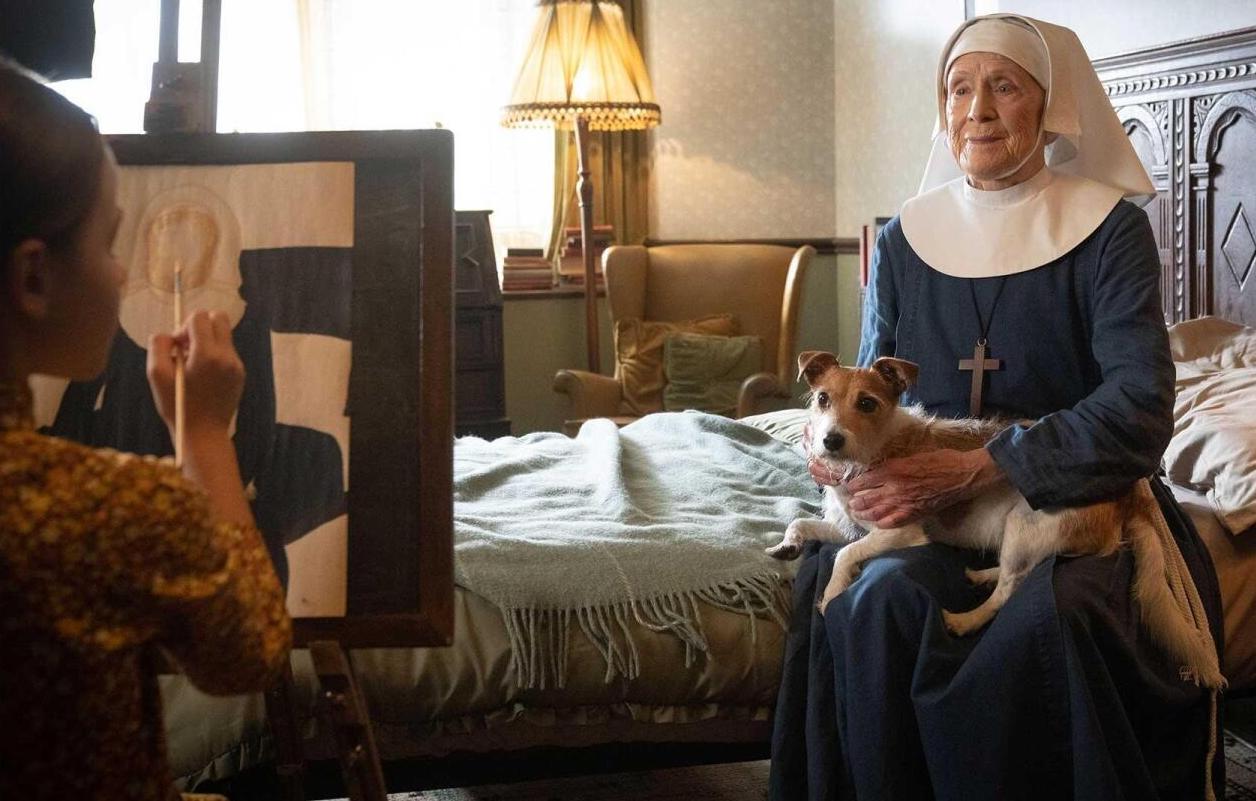 Picture shows: Sister Monica Joan (Judy Parfitt) sits on her bed with her dog in her lap while Colette (Francesca Fullilove) paints her portrait.
