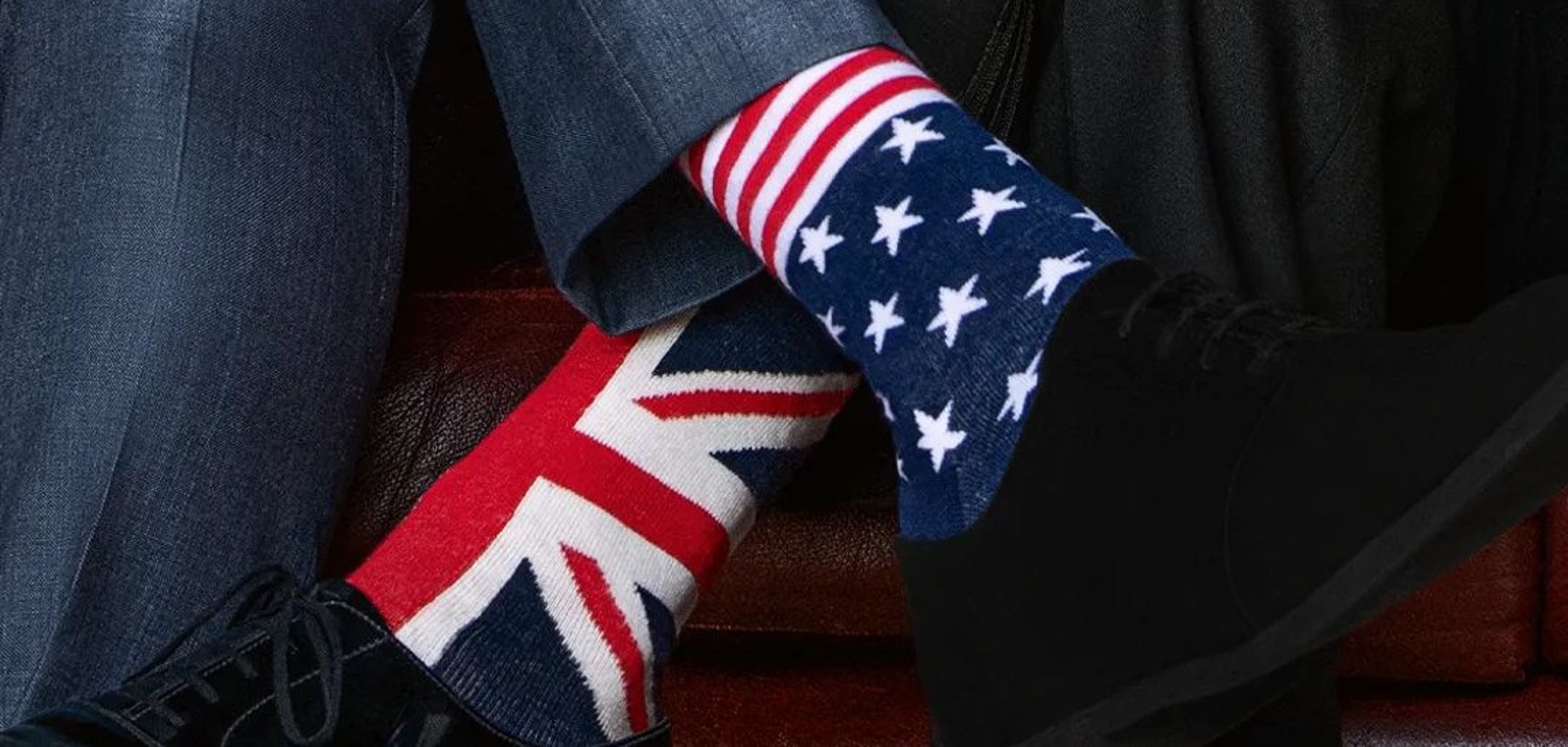 British and American flag socks representing the couple in Red White And Royal Blue's Key Art