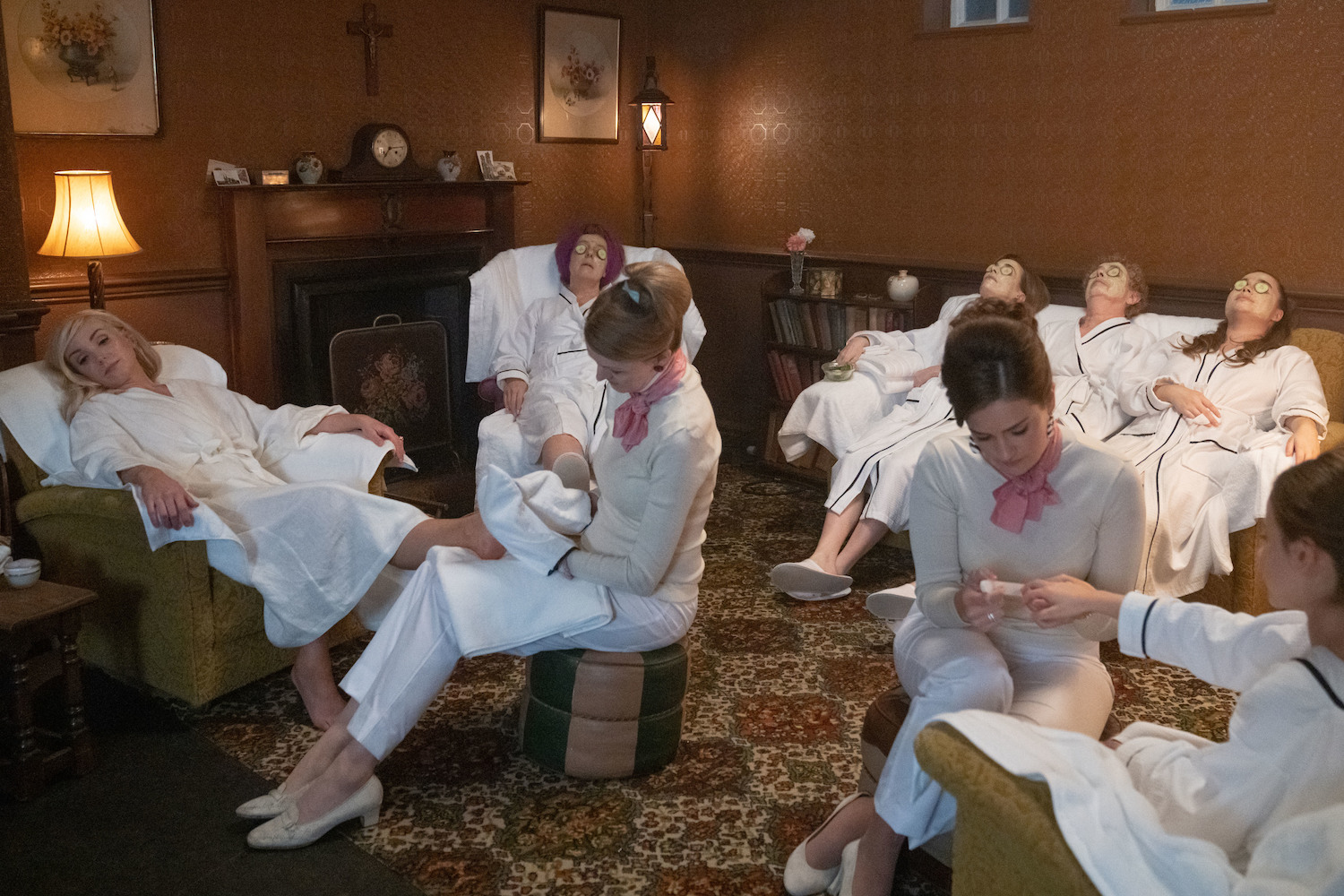 Picture shows: Trixie Franklin (Helen George) relaxes with her Nonnatus House friends before her big day. All the women are wearing white bathrobes and most of them have cucumber slices over their eyes. Two beauticians are on duty.