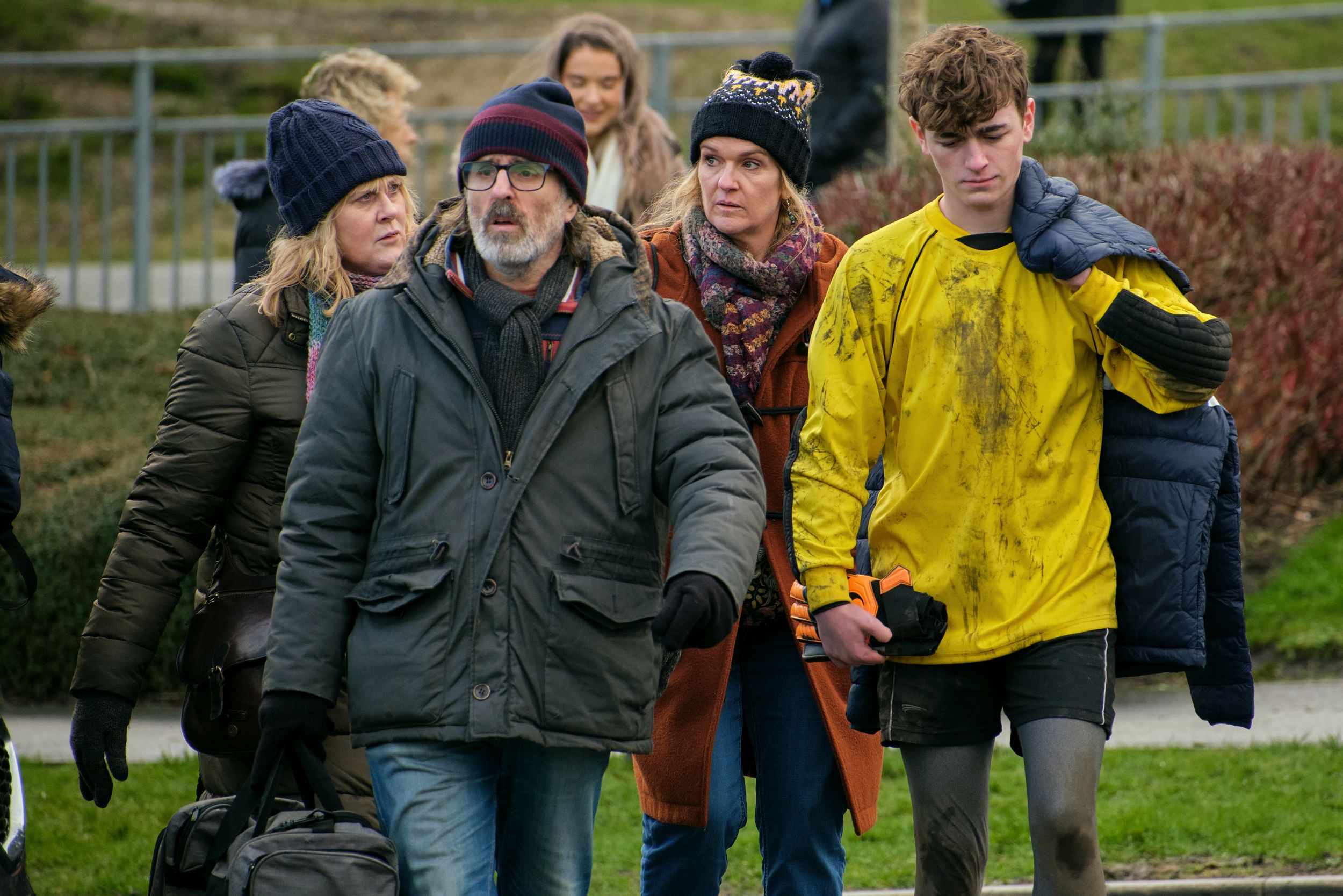 Sarah Lancashire as Catherine Cawood, Con O'Neill as Neil, Siobhan Finneran as Clare Cartwright, Rhys Connah as Ryan Cawood walk home from the local football gamein Happy Valley Season 3