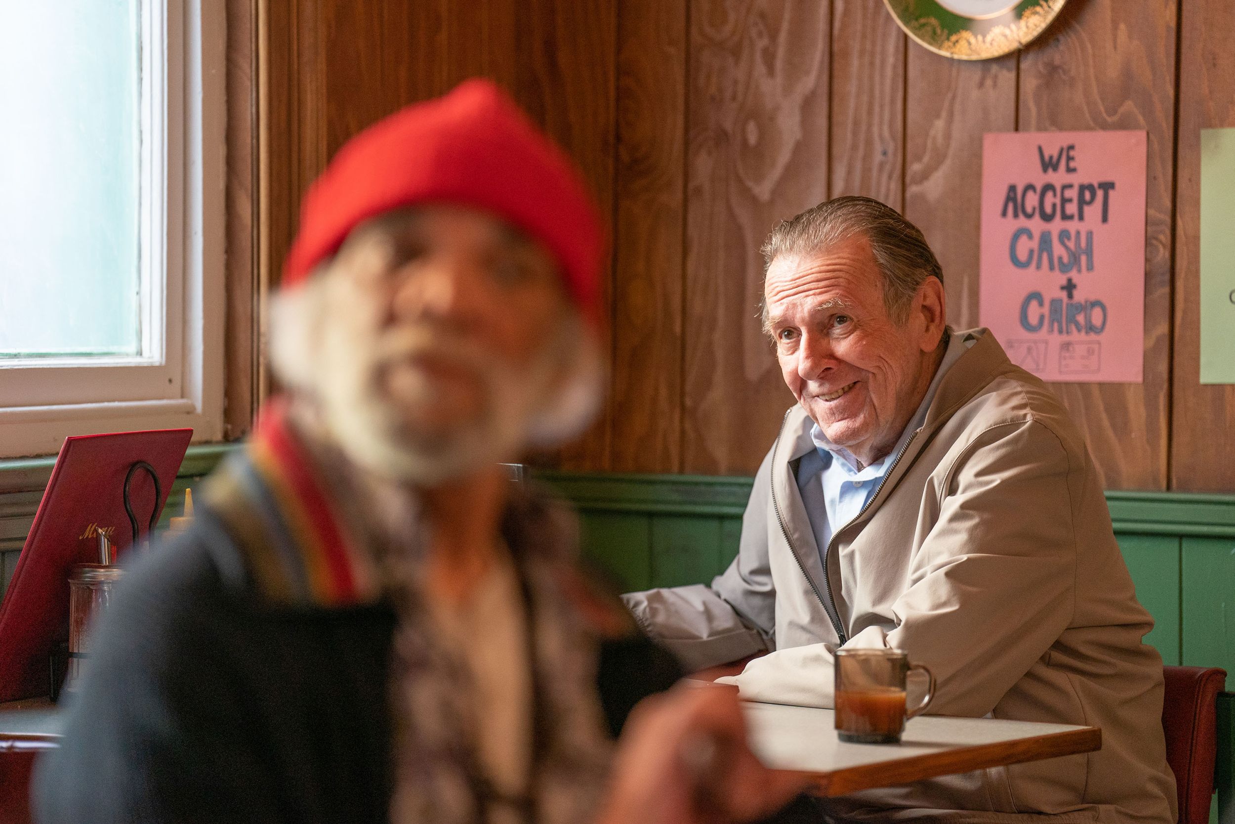 Tom Wilkinson as Gerald reading the paper at the diner in The Full Monty