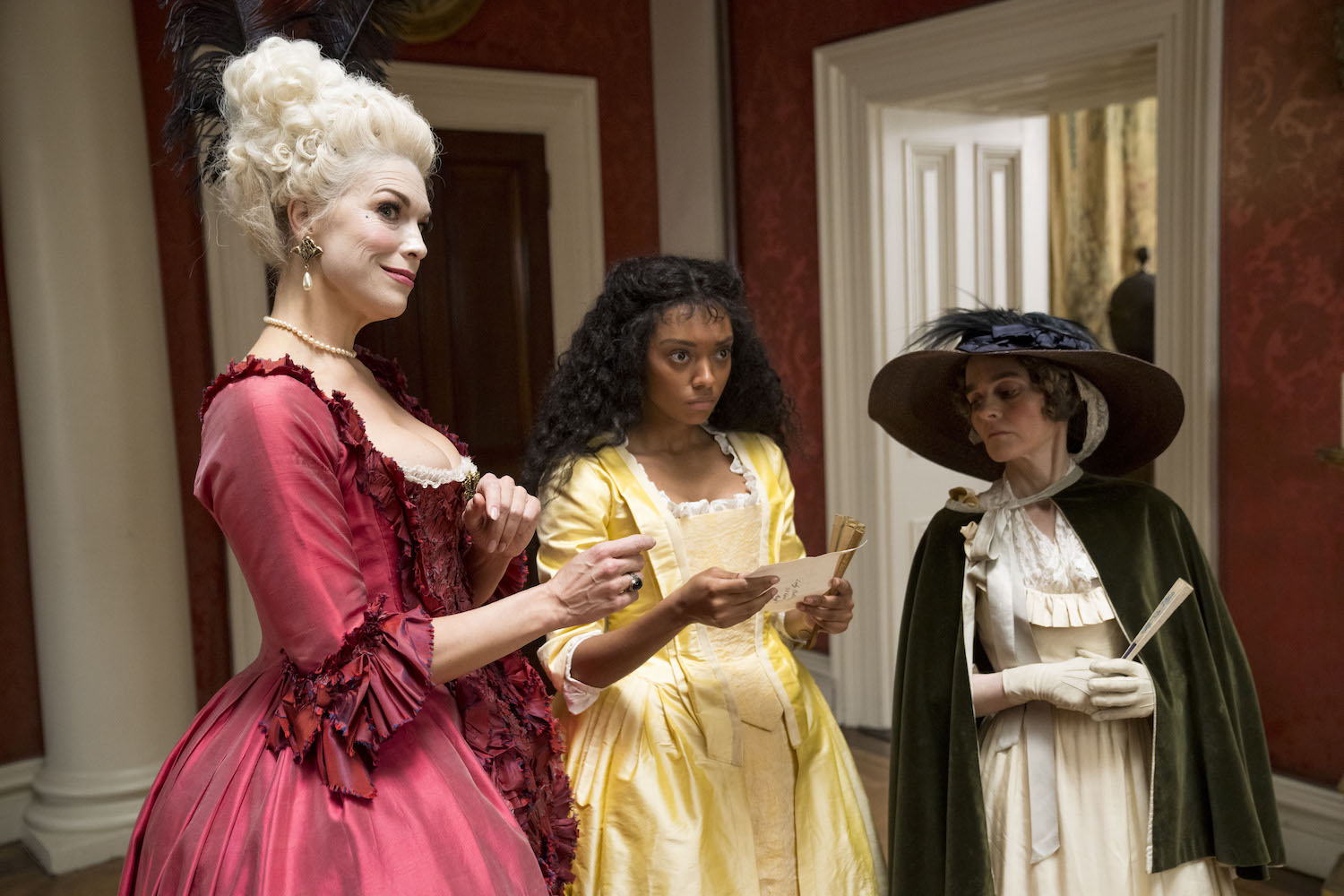 Picture shows: Lady Bellaston (Hannah Waddingham) smiles evilly as Sophia (Sophie Wilde) reads the letter from Tom, with Aunt Western (Shirley Henderson).
