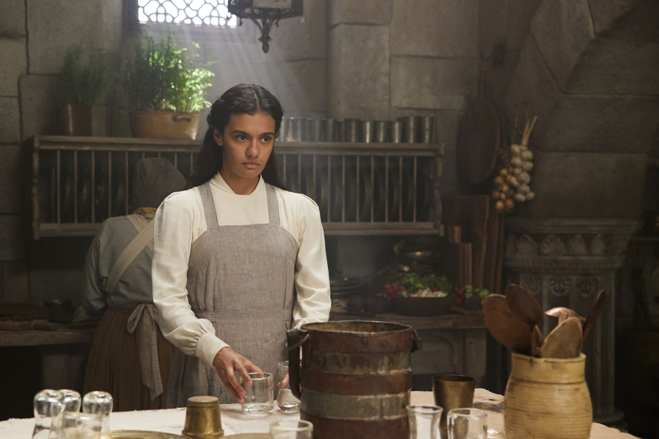Madeleine Madden as Egwene al'Vere as a novice in the White Tower kitchens in The Wheel of Time Season 2