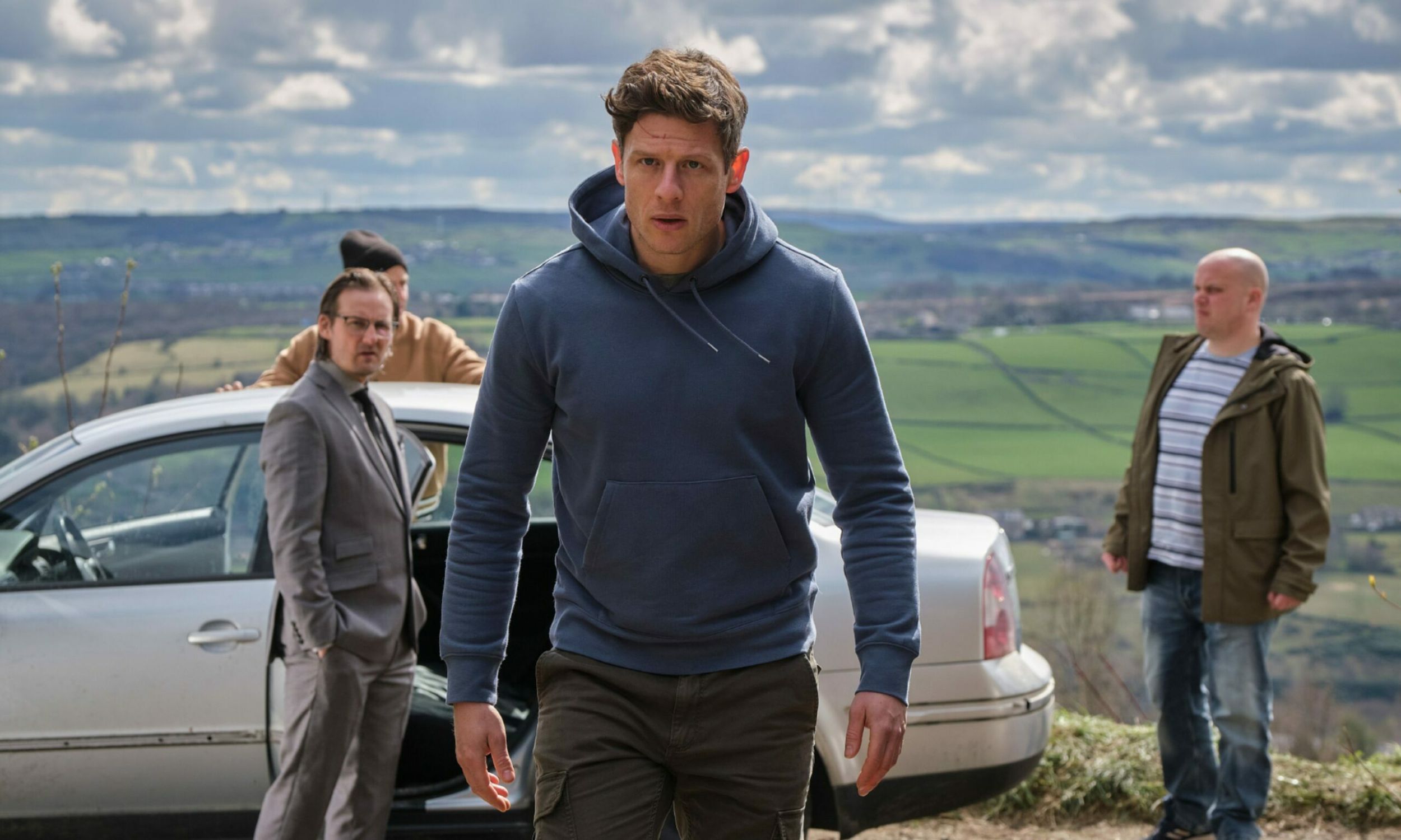 Anthony Flanagan as Viktor, Greg Kolpakchi as Zeljko, and James Norton as Tommy Lee Royce about to get in the car in Happy Valley Season 3