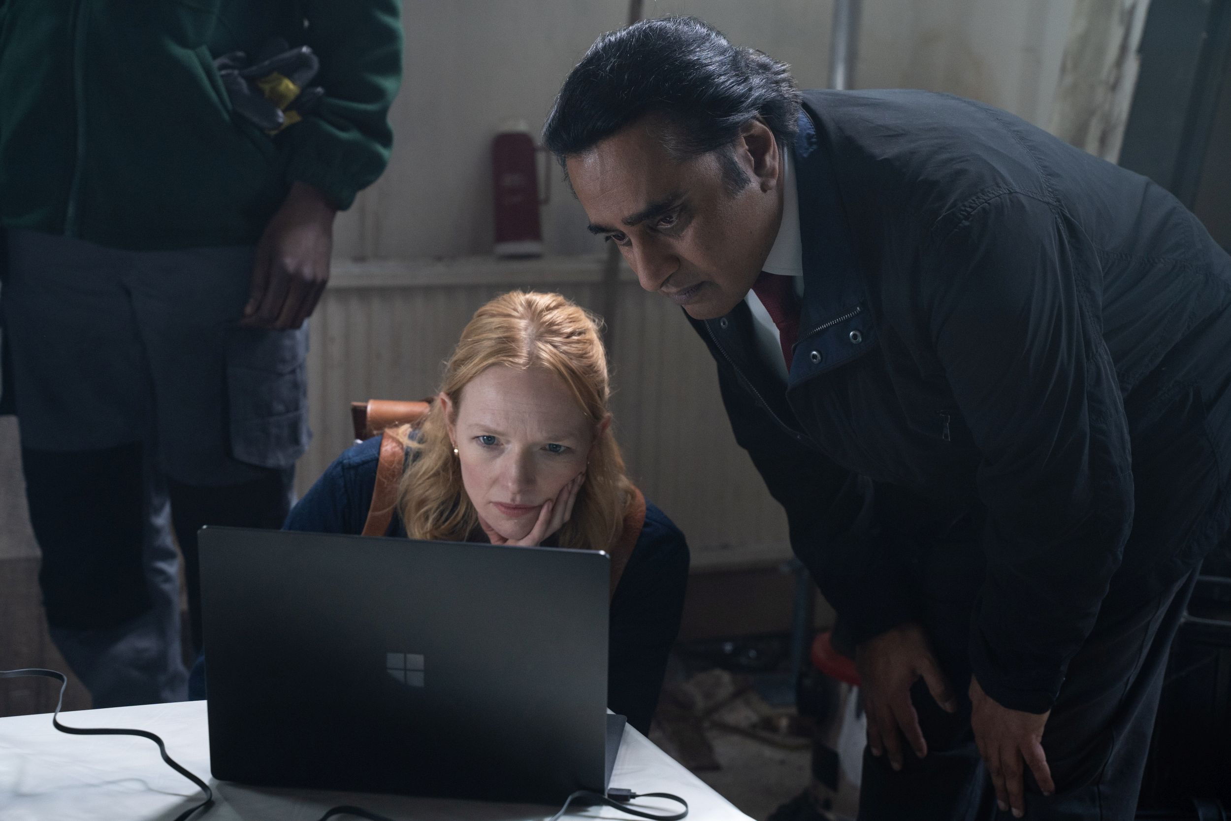 Carolina Main as DS Fran Lingley and Sanjeev Bhaskar as DI Sunny Khan huddle over a laptop in 'Unforgotten' Season 5