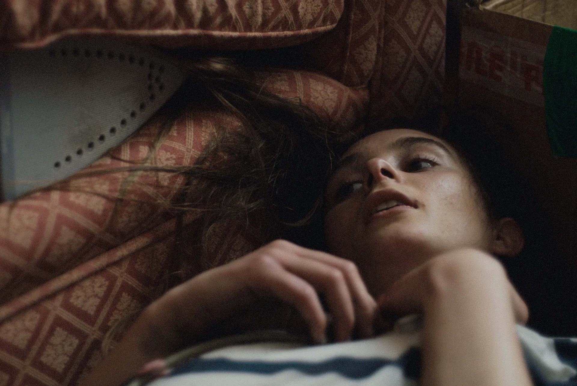 Saura Lightfoot Leon as Maria in bed in 'Hoard'