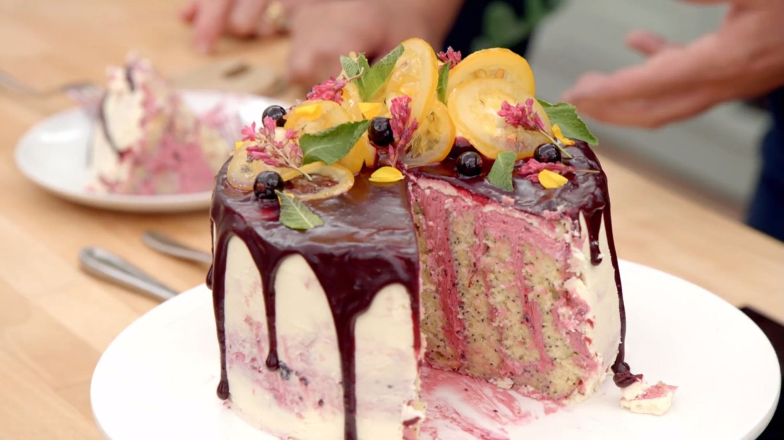 Abbi's Foraged Wild Poppy Seed, Lemon & Blackcurrant Vertical Layer Cake from the Cake Week Signature Challenge is perfectly decorated in The Great British Baking Show