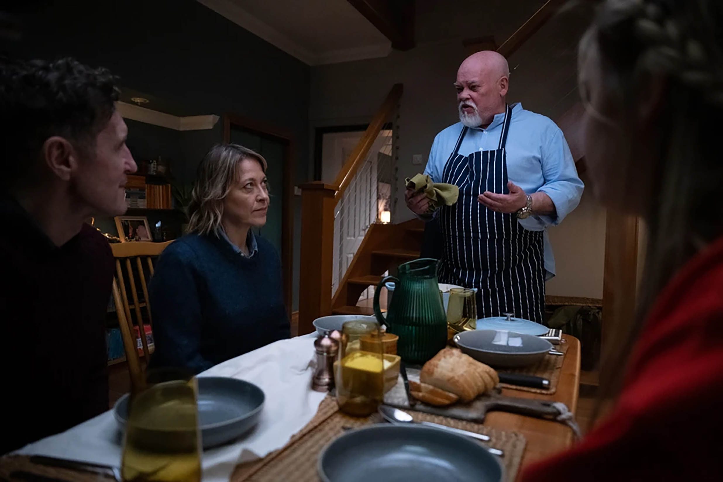 Paul McGann as Jake, Nicola Walker as Annika, Sven Henriksen as Magnus, and Silvie Furneaux as Morgan around the dinner table in 'Annika' Season 2
