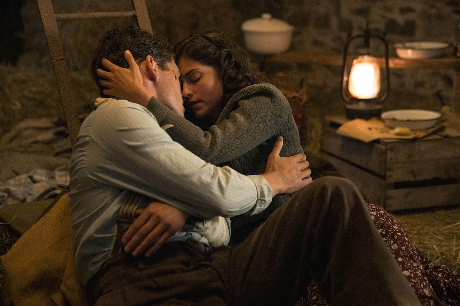 Picture shows: Henriette (Eugénie Derouand) and David (Gregg Sulkin) locked in a passionate embrace as they shelter in a barn