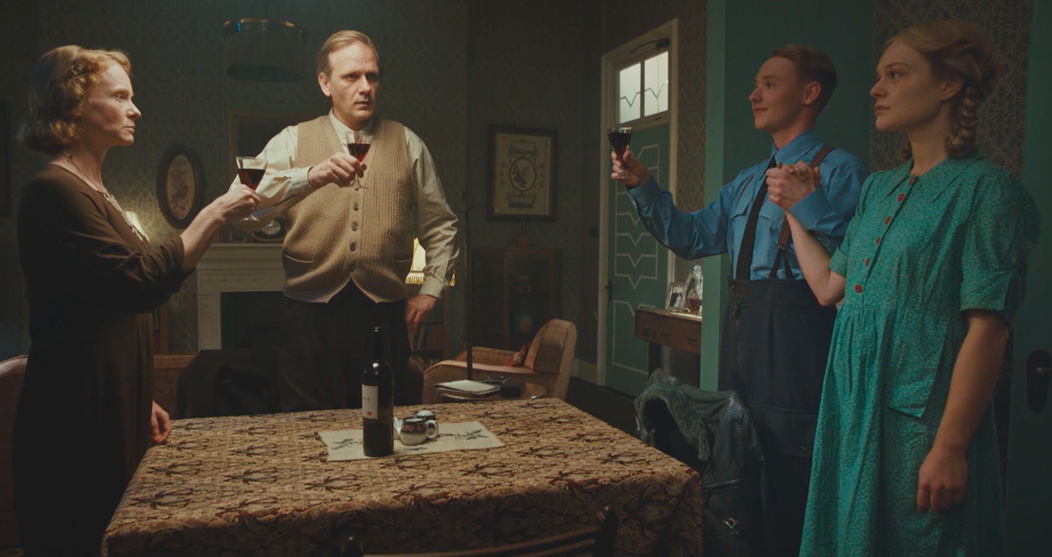 Picture shows: Marga (Miriam Schiweck) and her brother Ralf (Carl Grubel) toast the Nazi regime, while their parents (Frederika Ott and Matthiew Lier) go through the motions, having discovered they have spawned monsters.