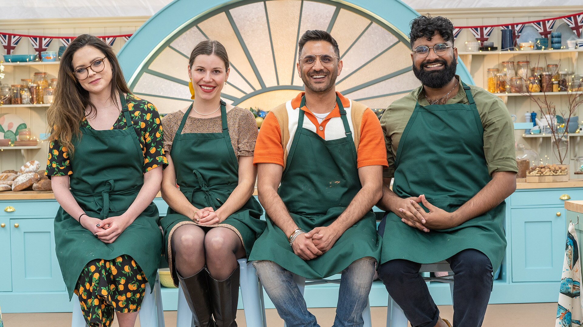 Lottie Bedlow, Manon Lagrève, Chigs Parmar, and Antony Amourdoux pose in the tent in 'The Great Festive Baking Show 2023' 