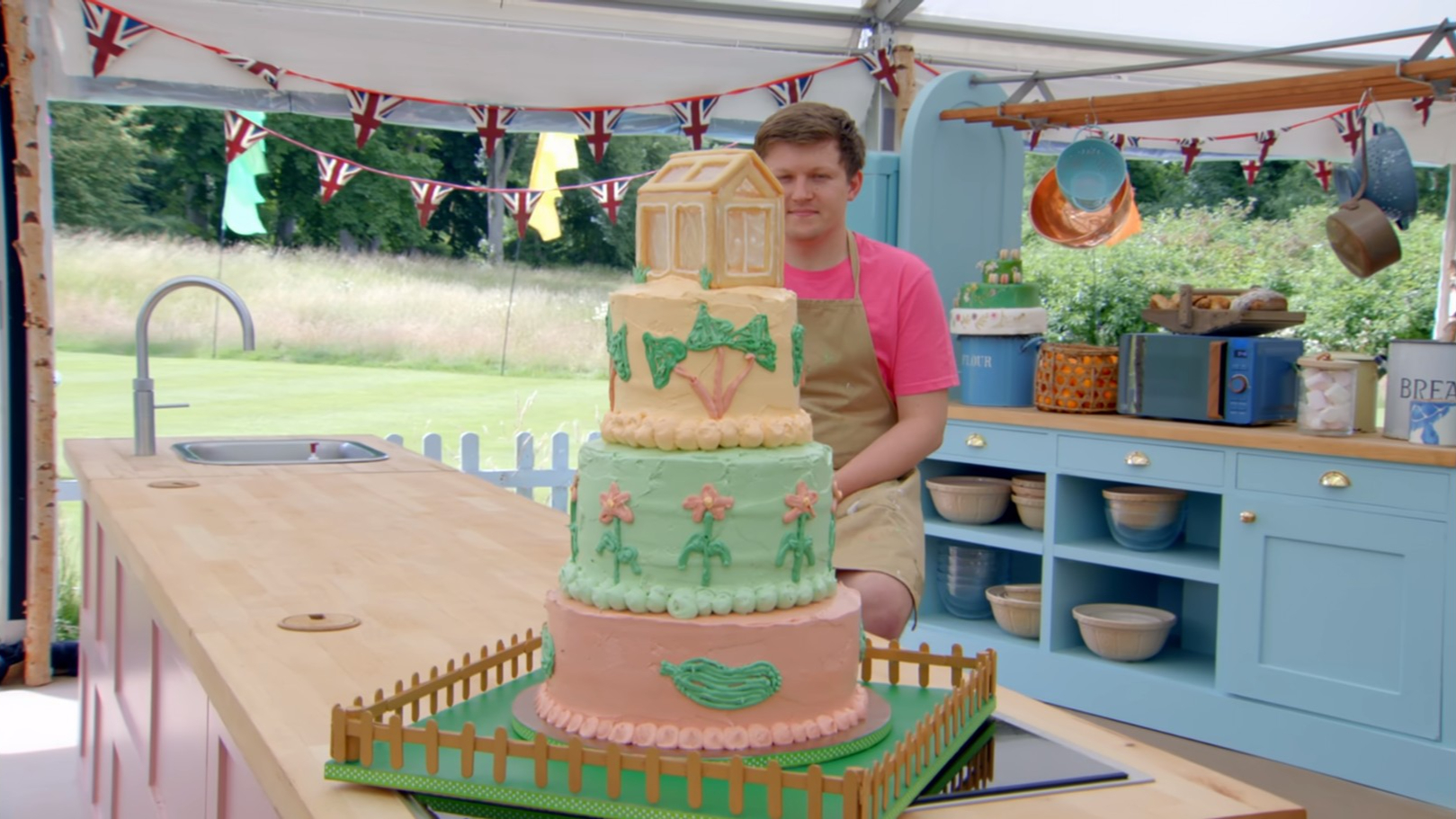 Josh with his A Slice For All Seasons Showstopper Cake from 'The Great British Baking Show' Season 14's Grand Final 