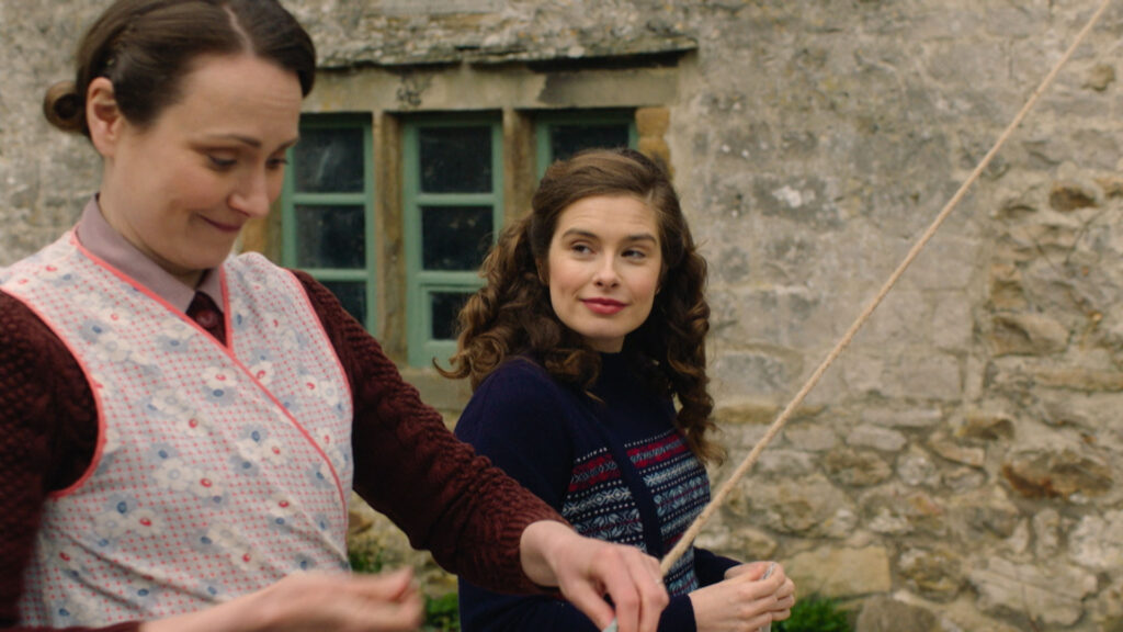 Picture shows: Mrs. Hall (Anna Madeley) and Helen Herriot (Rachel Shenton) chat as they hang out the wash.