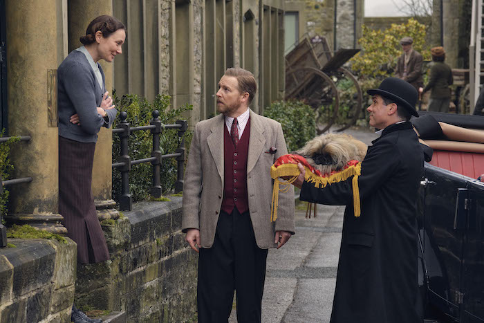 Mrs. Hall (Anna Madeley), Siegfried Farnon (Samuel West, Tricki Woo, and François (Joseph May). Credit: Courtesy of Playground Television (UK) Ltd.