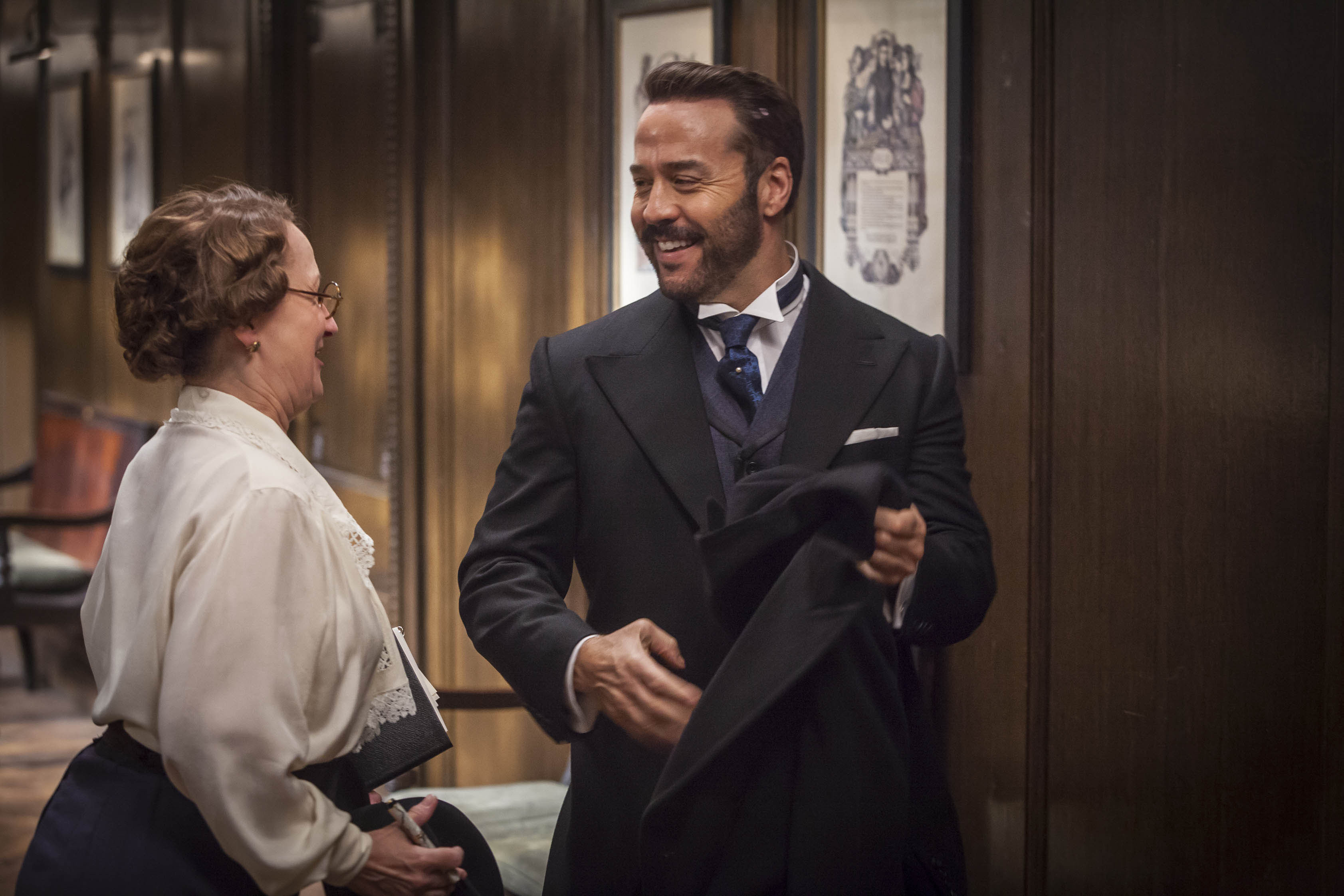 Harry Selfridge, probably playing Telephone with Miss Plunkett. (Photo: Courtesy of John Rogers/ITV Studios for MASTERPIECE)