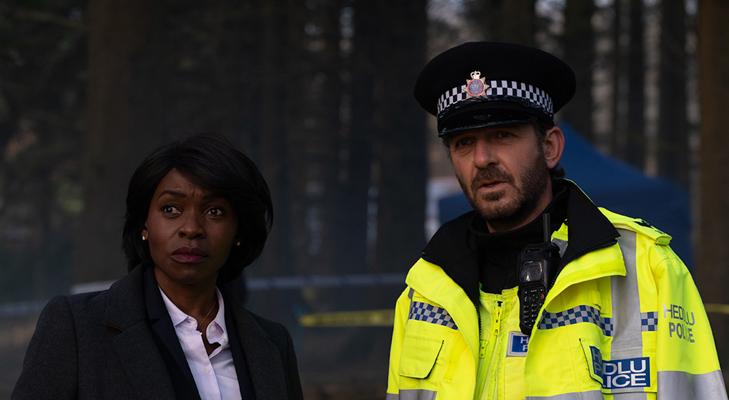 D.S. Holland (Rakie Oyula), Max (Jason Hughes). (Image Credit: BBC / Little Door (The Pact) / Warren Orchard)