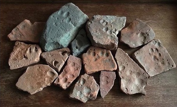 Floortiles with animal footprints. Lara Maiklem on Instagram @london.mudlark