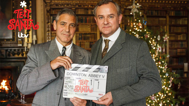George Clooney and Hugh Bonneville on the set of "Downton Abbey". (Photo: ITV/Nick Briggs)