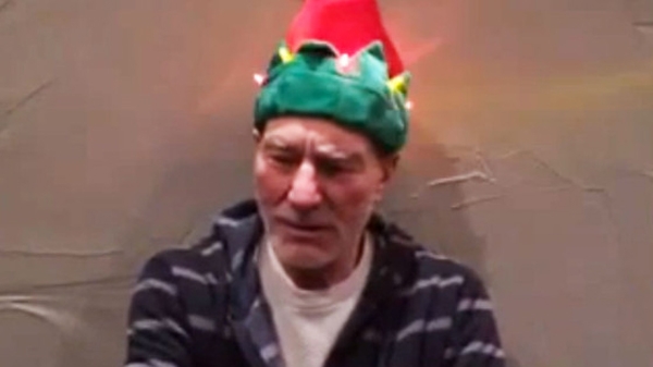 Sir Patrick Stewart and his amazing Christmas hat. (Photo: Screenshot via YouTube)