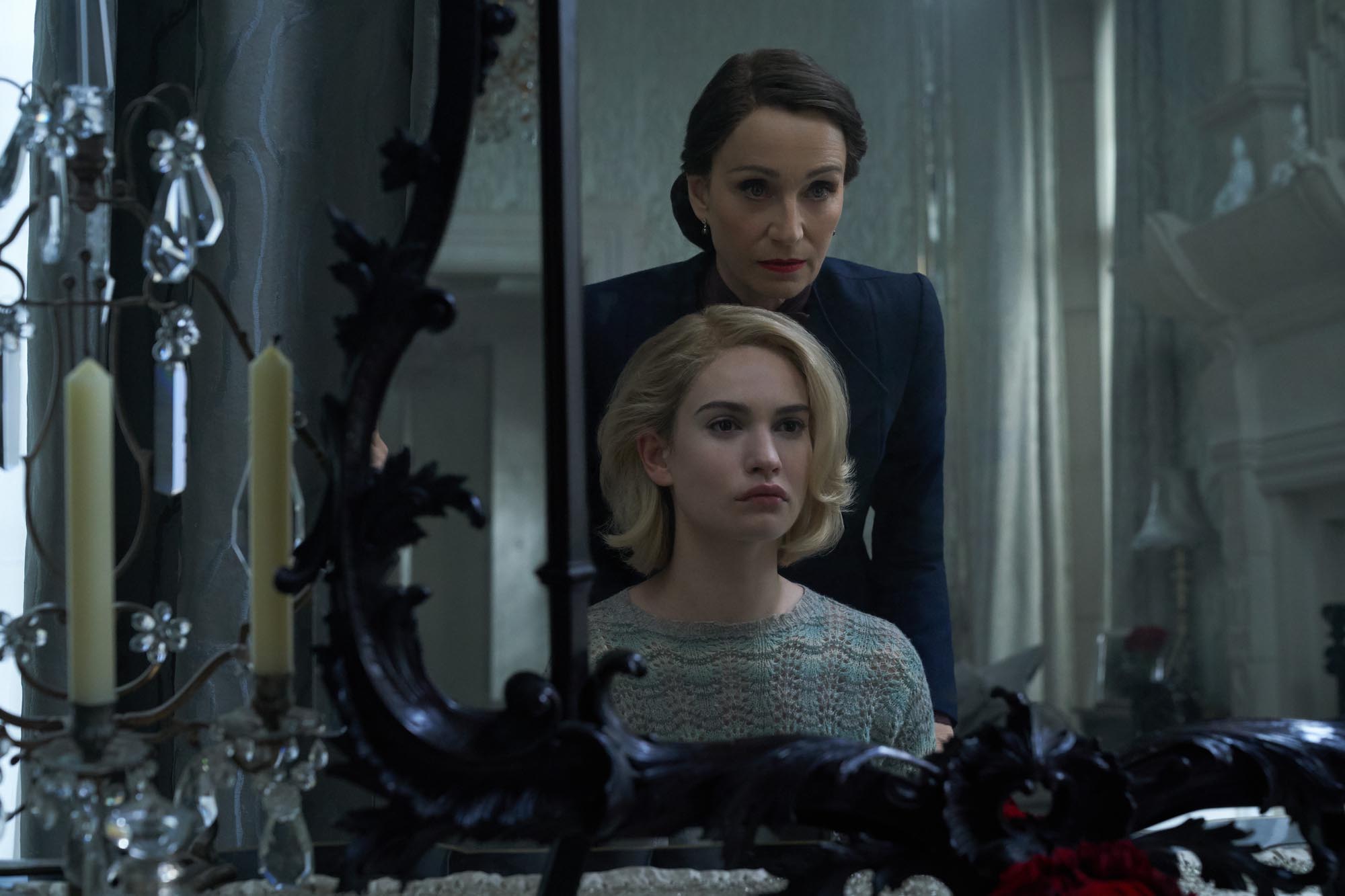 Mrs. Danvers (Kristin Scott Thomas) and the second Mrs. de Winter (Lily James). © Netflix