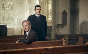 Tom Brittney as Will Davenport and Robson Green as Geordie Keating sitting in church pews in 'Grantchester' Season 8's Key Art 