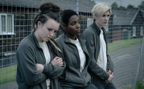 Bella Ramsey as Kelsey, Tamara Lawrance as Abi, and Jodie Whittaker as Orla in the prison yard 'Time' Season 2