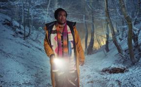 Wunmi Mosaku as Former Met Police Detective Riya Ajunwa searches through the snowy woods in 'Passenger'