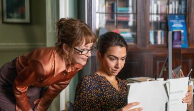 Picture shows: Lesley Manville as Susan Ryeland and Danielle Ryan as Alice reading a manuscript in PBS' 'Magpie Murders'