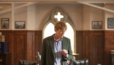 Picture shows: DI Humphrey Goodman (Kris Marshall) standing in front of a window at the police station.