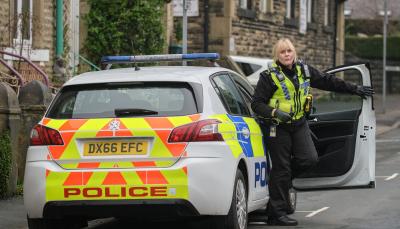 Sarah Lancashire as Catherine Cawood exits the police vehicle in Happy Valley Season 3