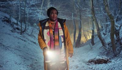 Wunmi Mosaku as Former Met Police Detective Riya Ajunwa searches through the snowy woods in 'Passenger'