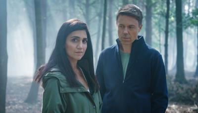 Leila Farzad as DCI Lou Slack and Andrew Buchan as Col McHugh in a forest in 'Better'