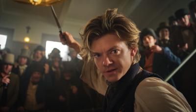Thomas Brodie-Sangster as Jack brandishes a knife in The Artful Dodger