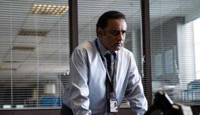 Sanjeev Bhaskar as DI Sunny Khan stands at his desk in 'Unforgotten' Season 5