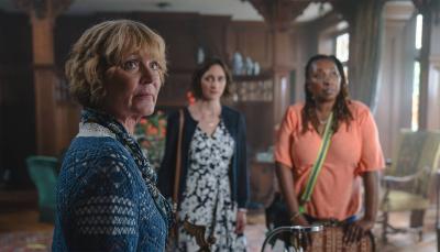 Samantha Bond as Judith Potts, Cara Horgan as Becks Starling, and Jo Martin as Suzie Harris in the library of 'The Marlow Murder Club'