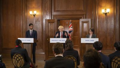 Shri Patel as Rishi Sunak, Kenneth Branagh as Boris Johnson at their podiums in 'This England'