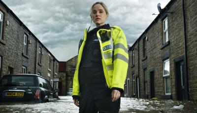 Sophie Rundle as PC Joanna Marshall up to her knees in water in 'After the Flood'