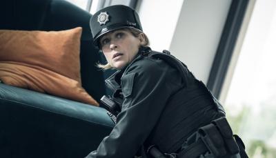 Siân Brooke as Constable Grace Ellis finds some evidence in 'Blue Lights' Season 1