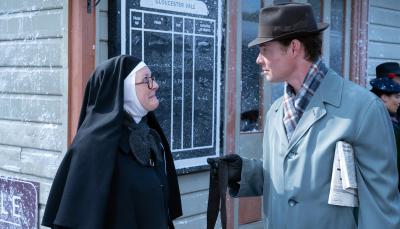 Lorna Watson as Sister Boniface and Max Brown as DI Sam Gillespie consult in the snow in 'Sister Boniface Mysteries' Season 3 Christmas Special