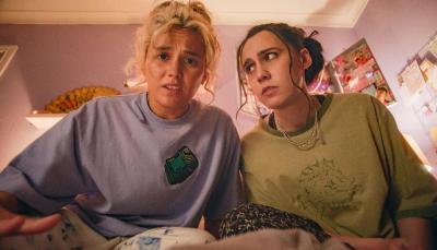 Kat Sadler as Josie, Lizzie Davidson as Billie stare in horror at something under the bed in 'Such Brave Girls'