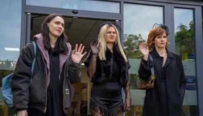 Kat Sadler as Josie, Lizzie Davidson as Billie, and Louise Brealey as Deb wave goodbye in 'Such Brave Girls'